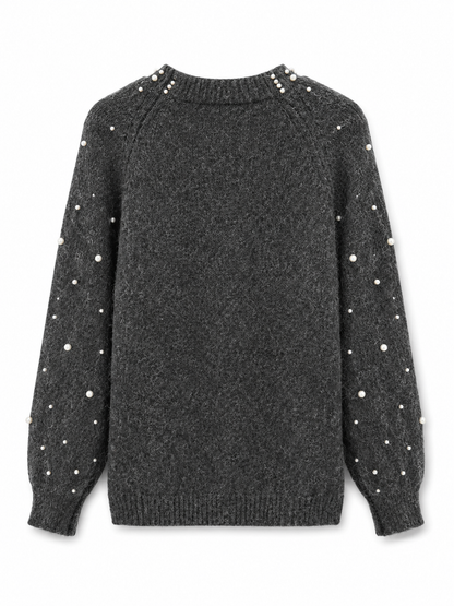 Strik med perledetaljer