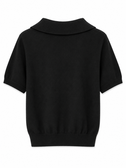 Kortærmet strikbluse med lag-på-lag look