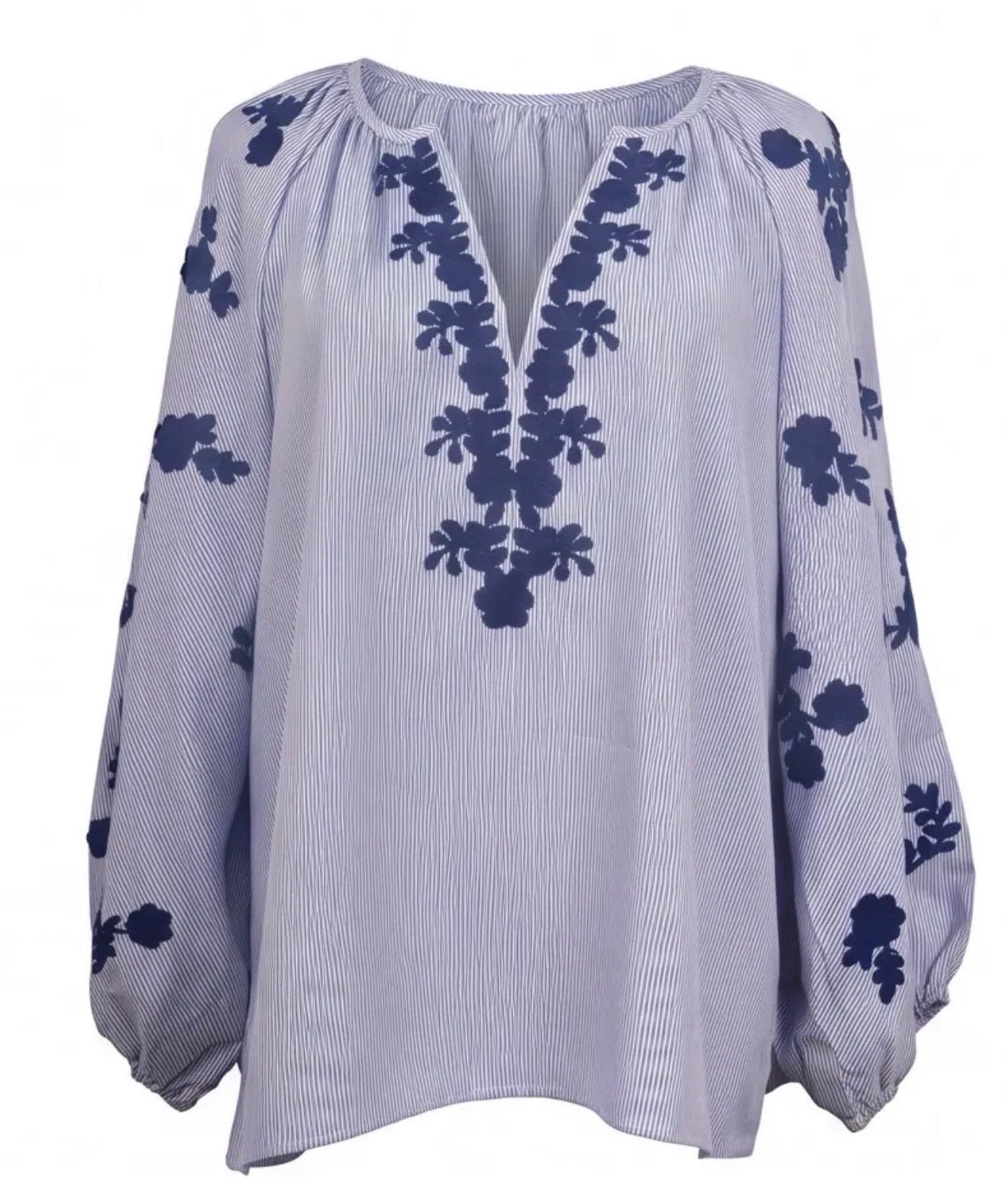 Lyseblå bomuldsbluse med blomsterdetaljer