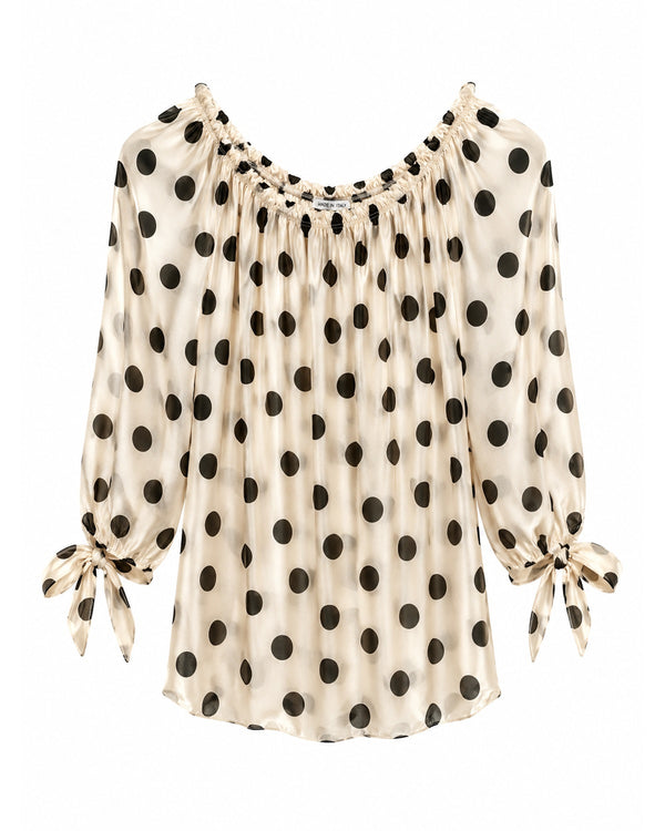 Bluse med sorte polkaprikker